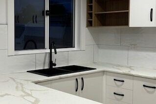 Newly tiled kitchen splashback and bench area